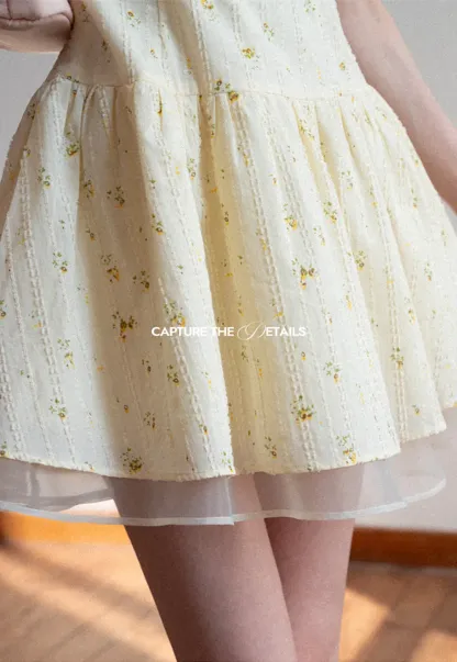 Sleeveless floral dress with layered skirt