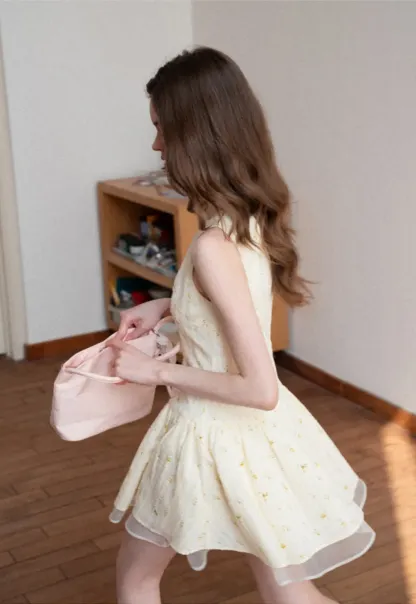 Sleeveless floral dress with layered skirt