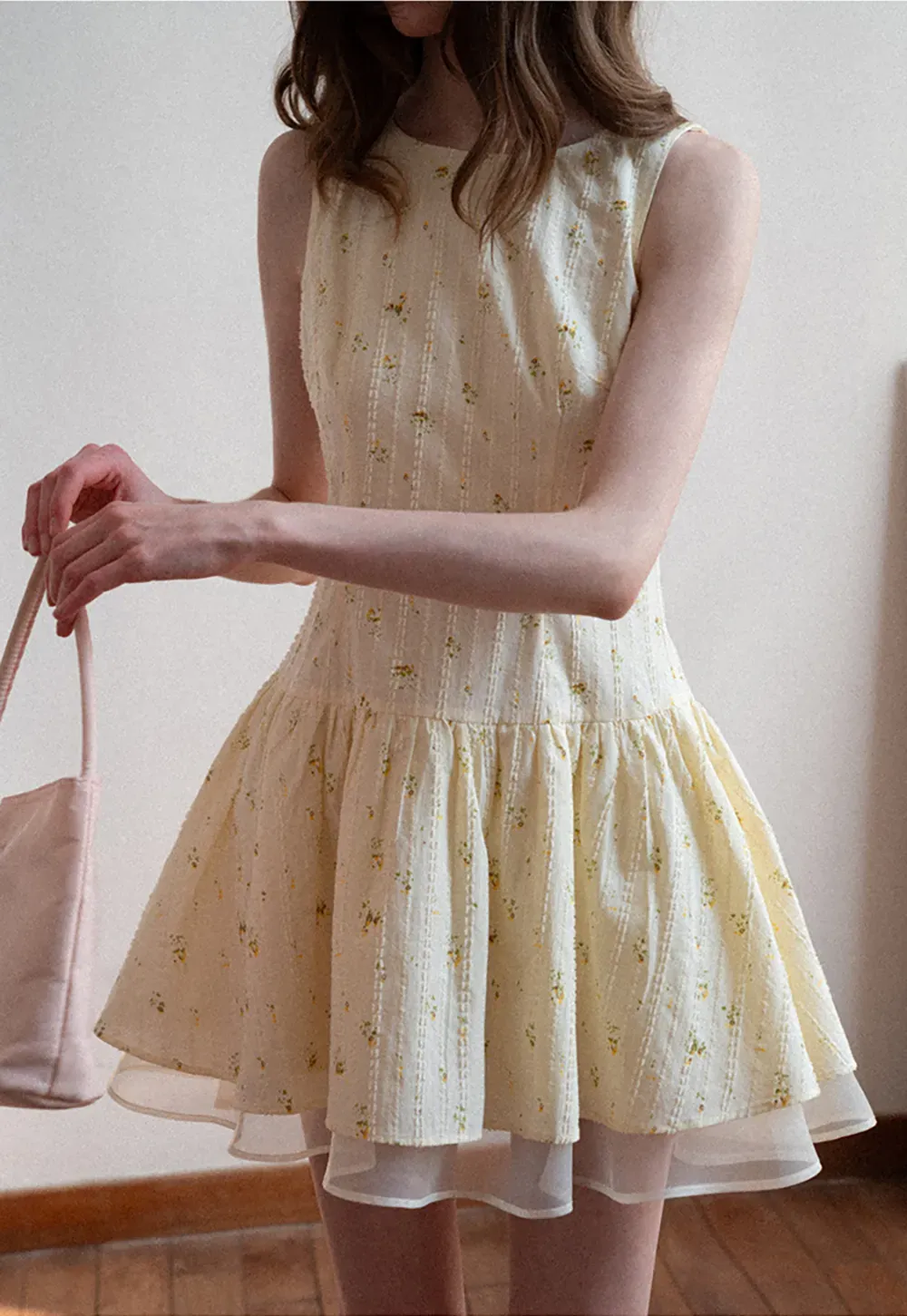 Sleeveless floral dress with layered skirt