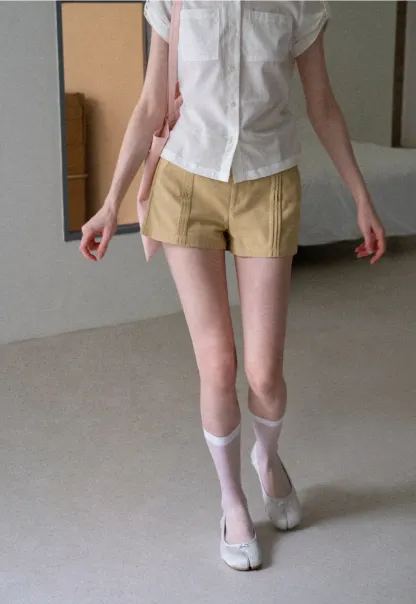 High Waist Pleated Shorts with Button Detailing