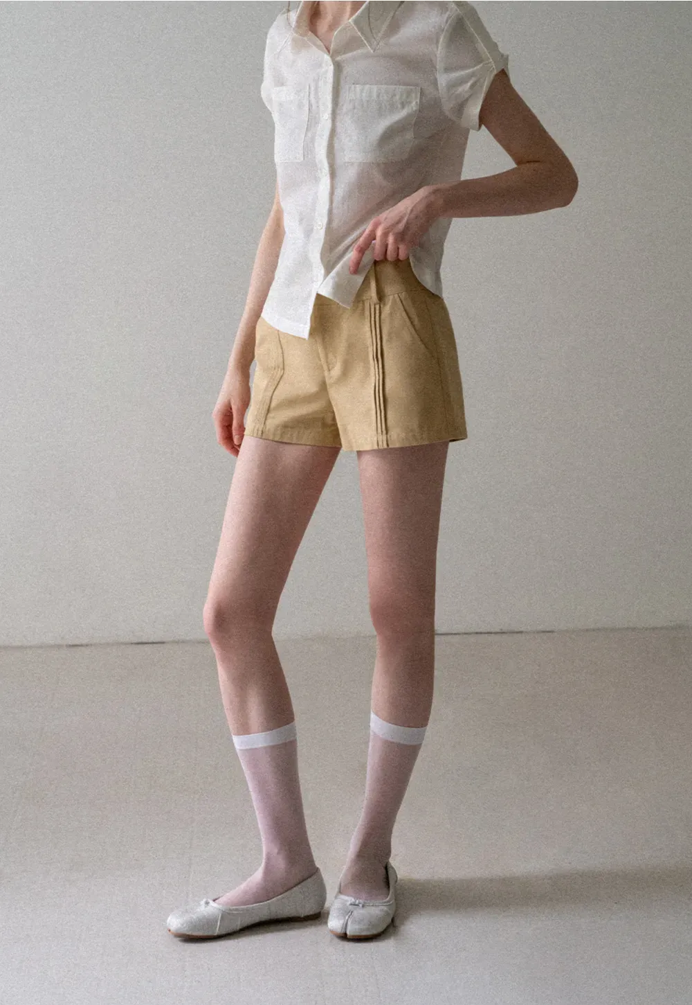 High Waist Pleated Shorts with Button Detailing