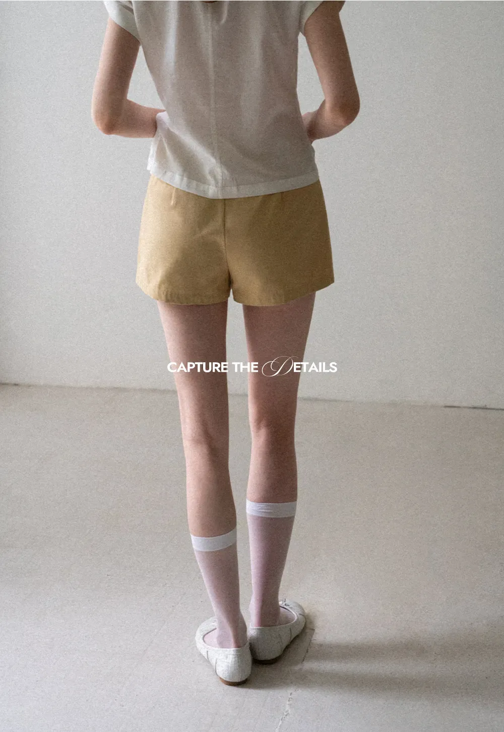 High Waist Pleated Shorts with Button Detailing