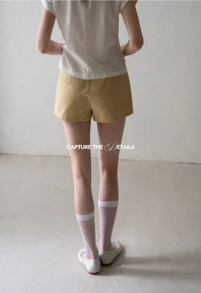 High Waist Pleated Shorts with Button Detailing