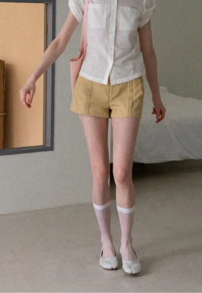 High Waist Pleated Shorts with Button Detailing