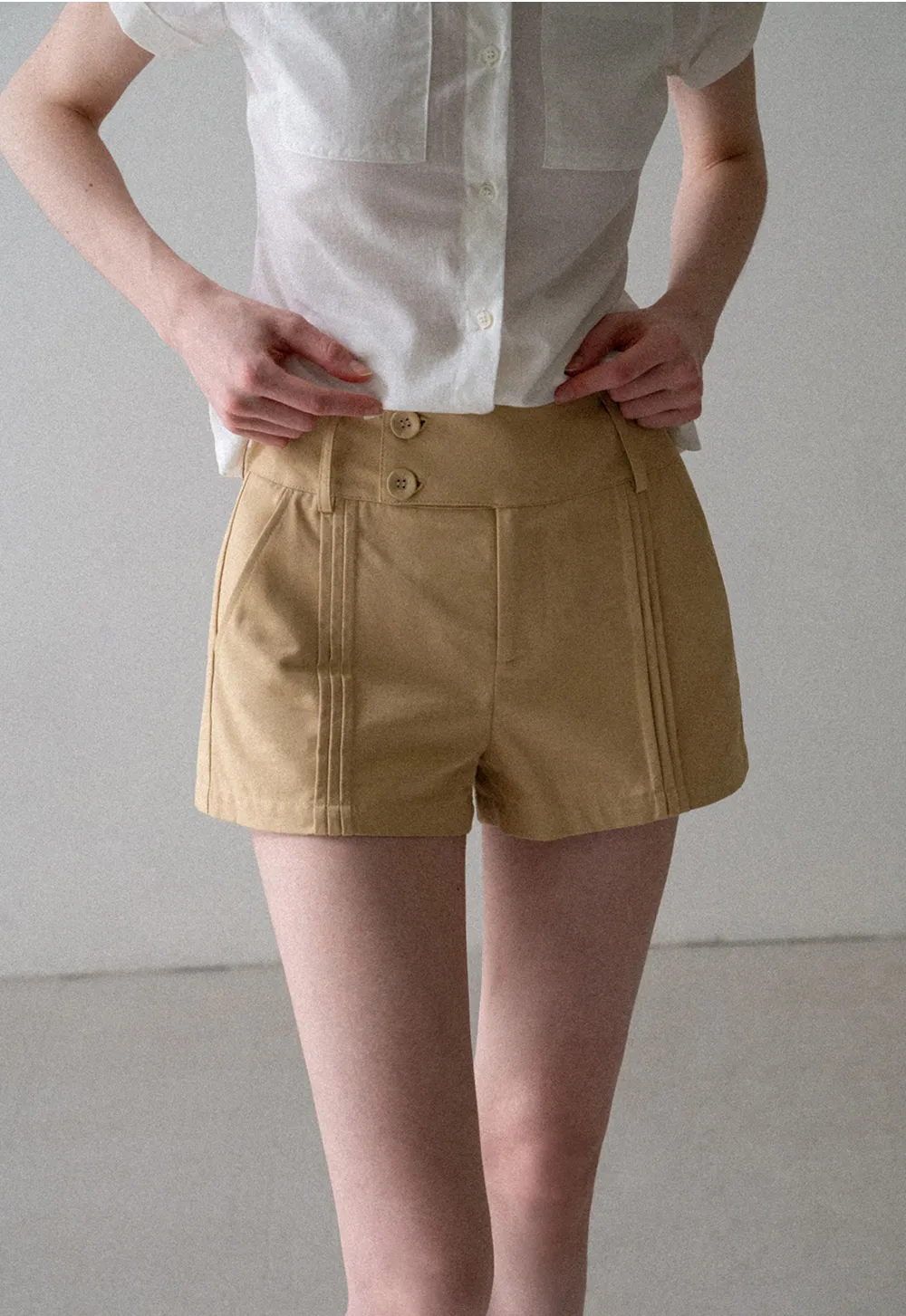 High Waist Pleated Shorts with Button Detailing