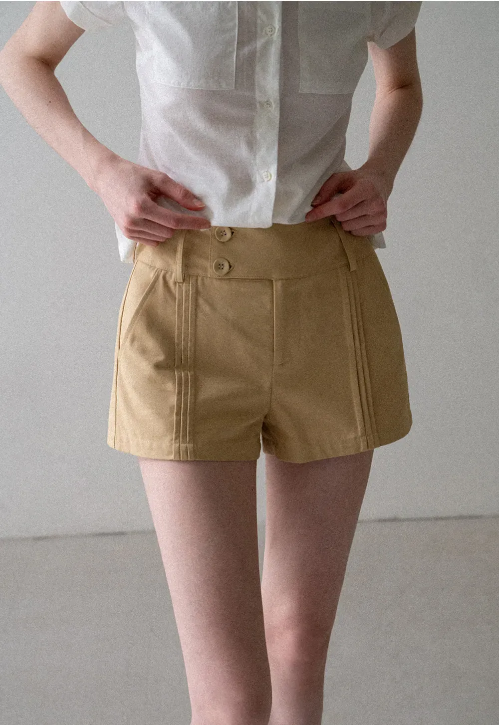 High Waist Pleated Shorts with Button Detailing