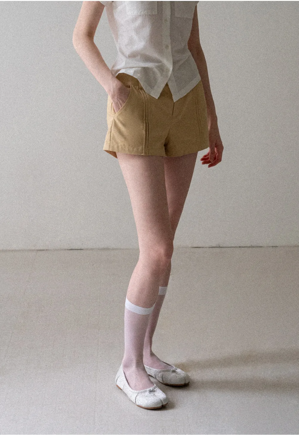 High Waist Pleated Shorts with Button Detailing