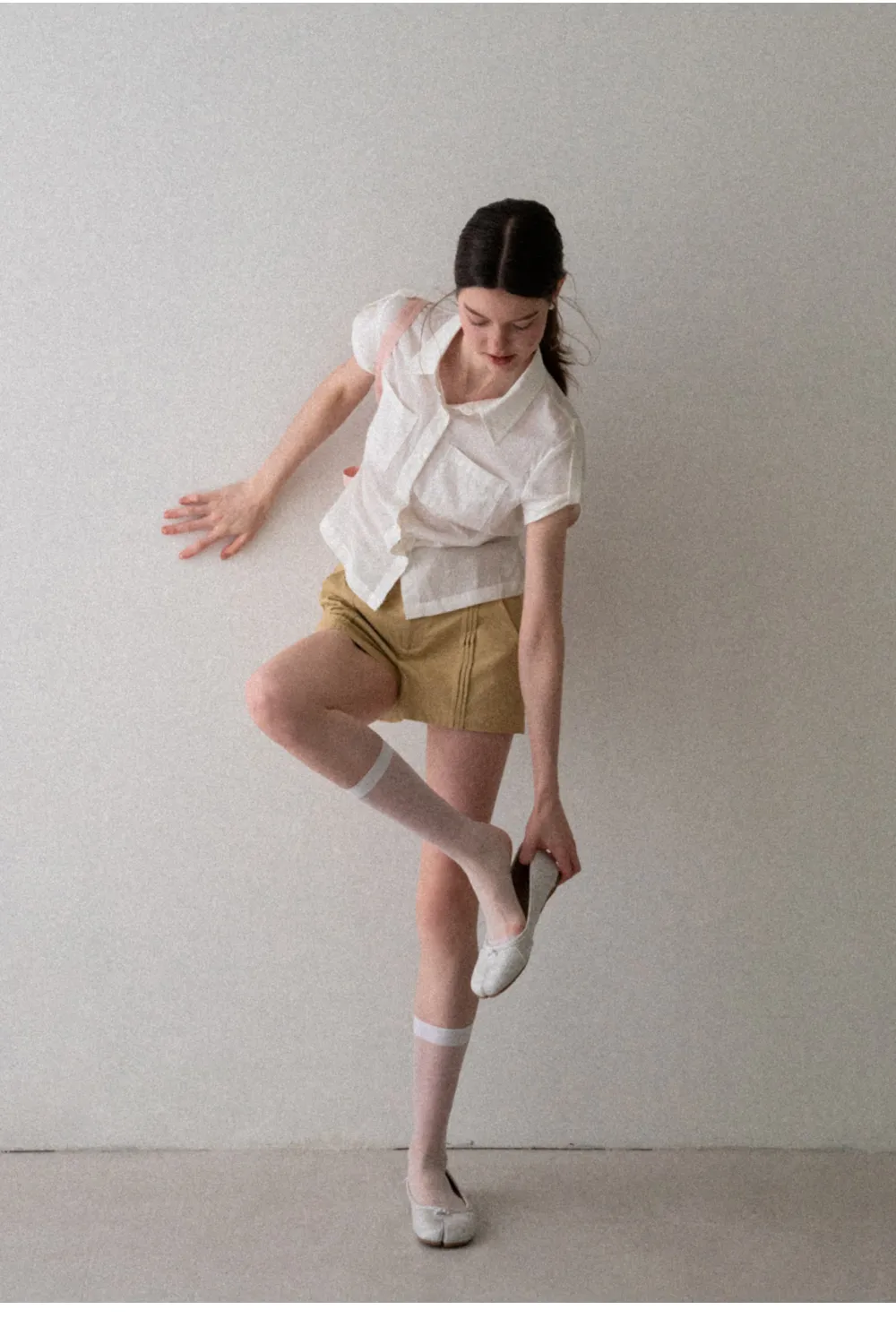 High Waist Pleated Shorts with Button Detailing