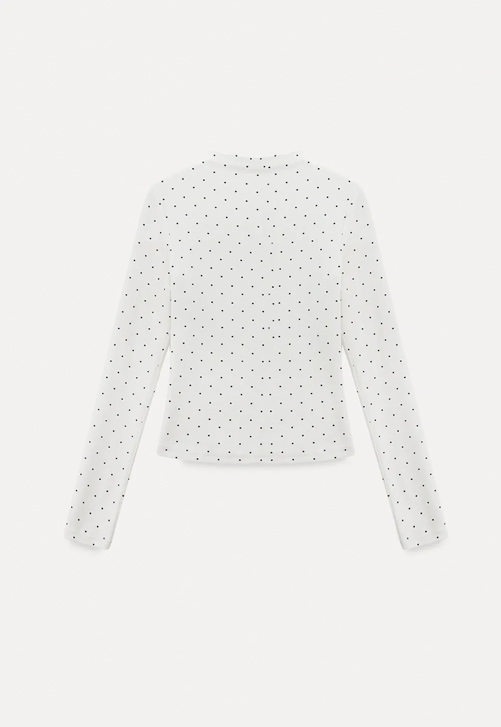 Elegant sleeveless dress with collar layered over polka dot top