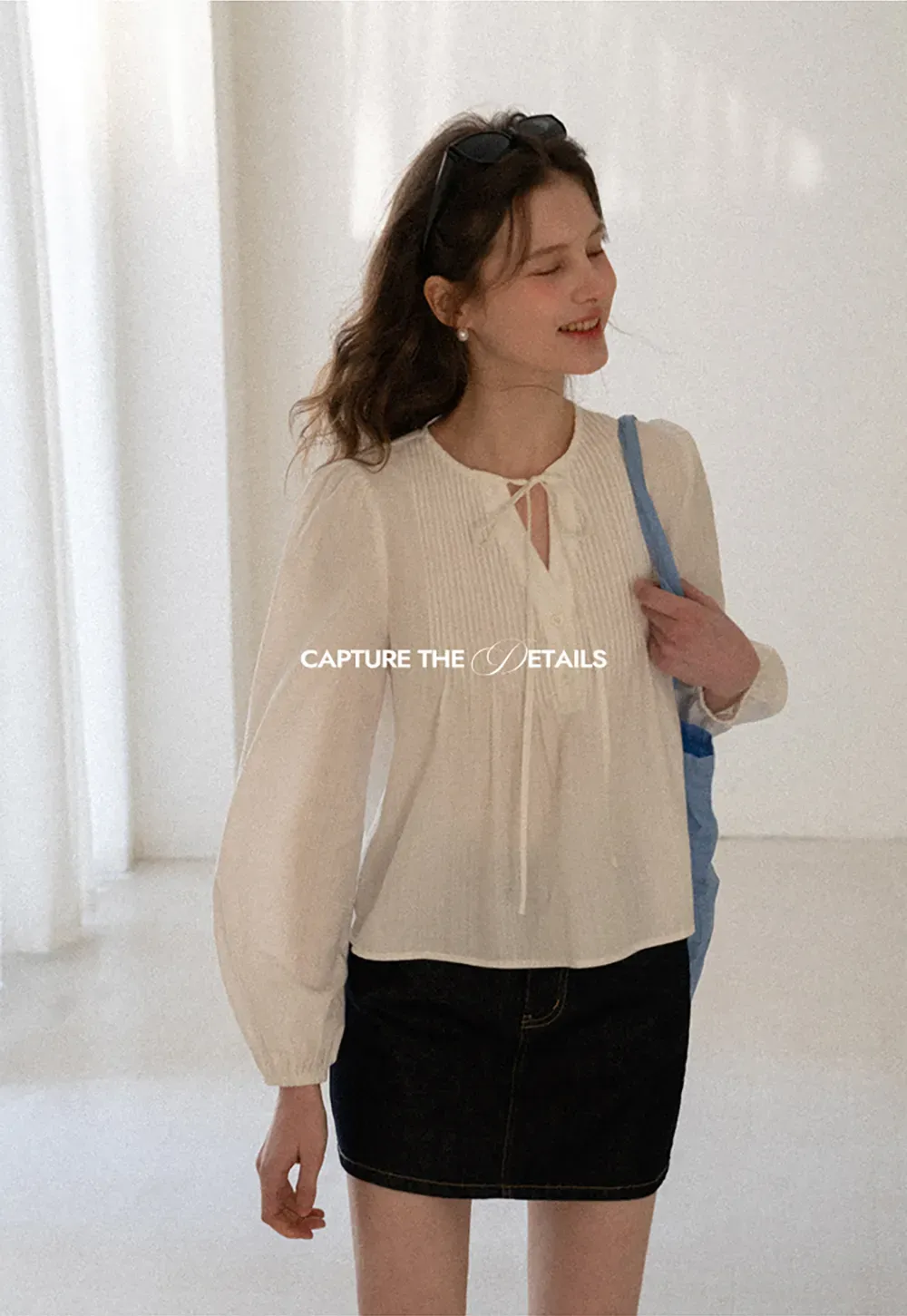 Pleated blouse with tie neck and long sleeves