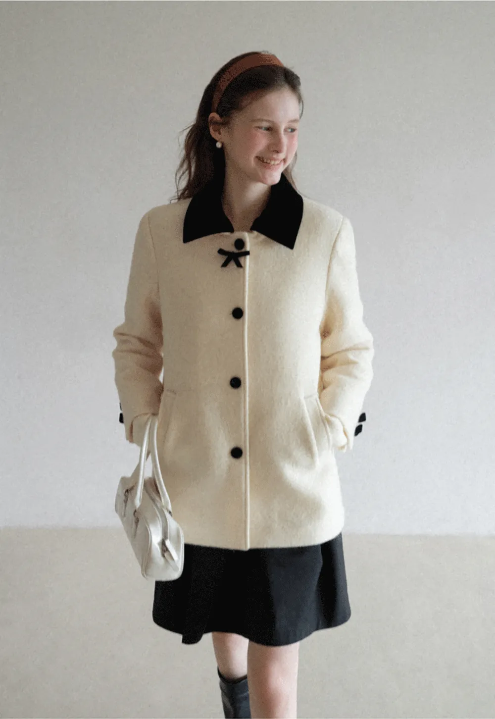Elegant Wool Coat with Bow Detail and Contrasting Collar