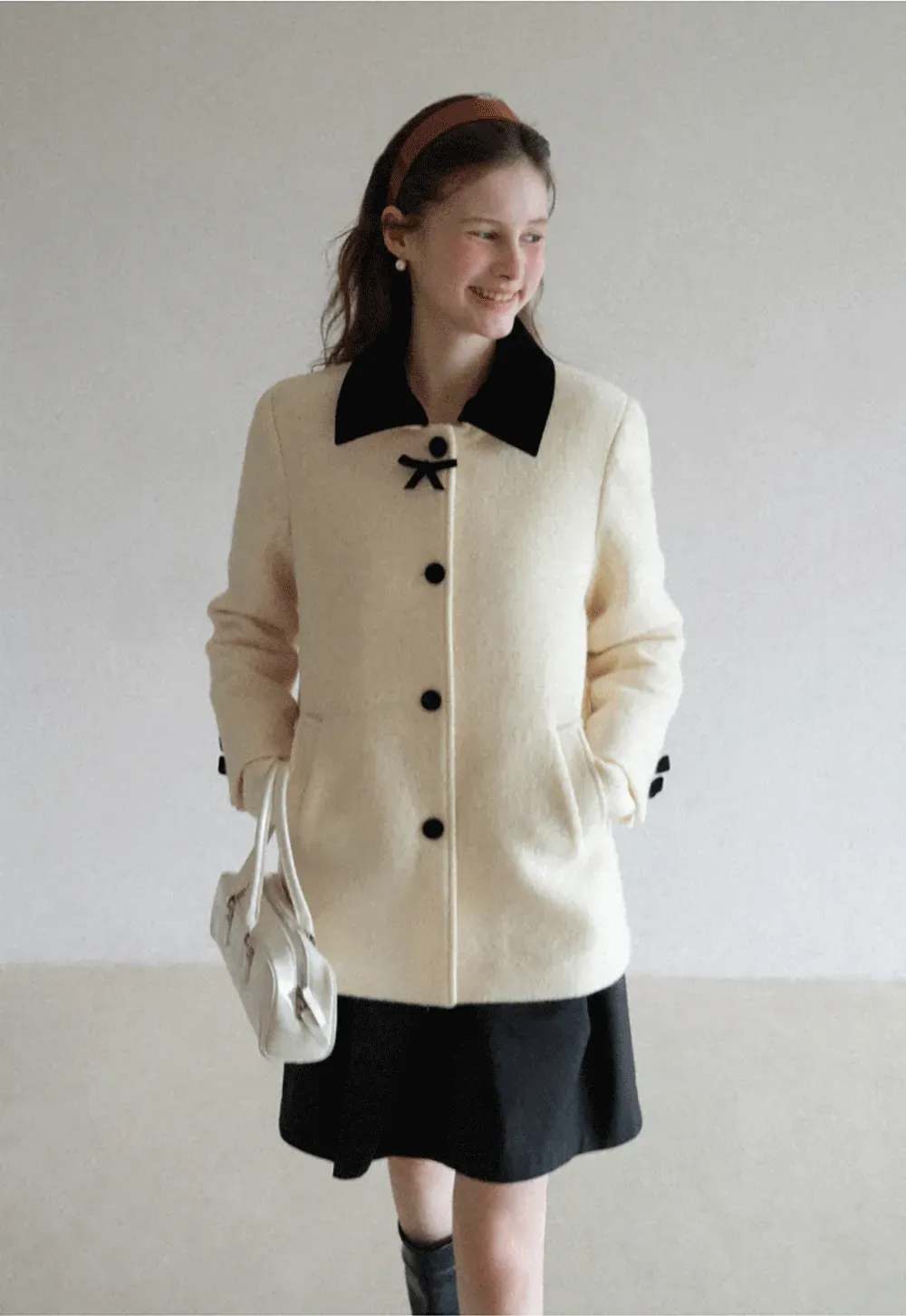 Elegant Wool Coat with Bow Detail and Contrasting Collar