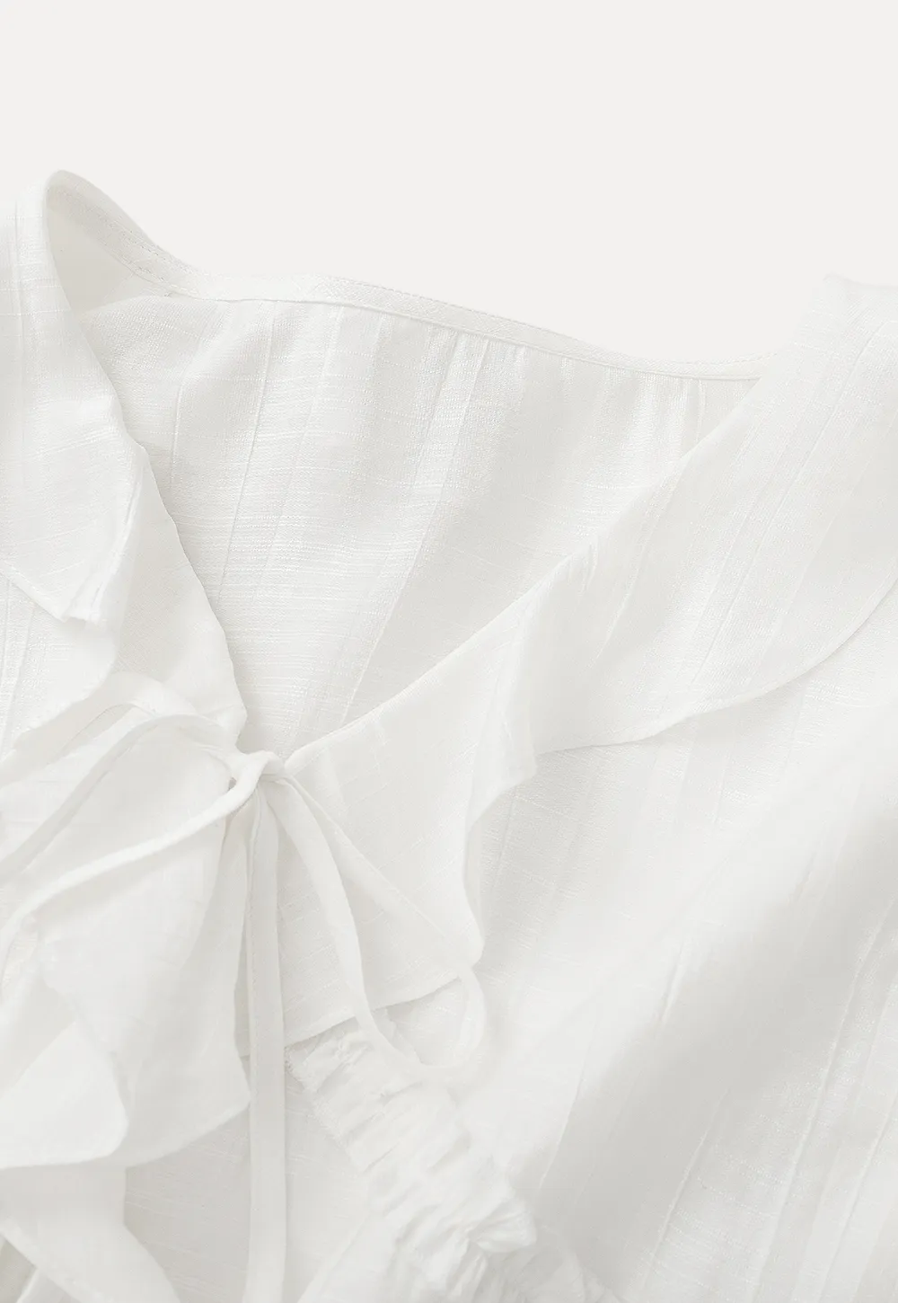 Elegant Blouse with Ruffle Detail and Tie Front Design