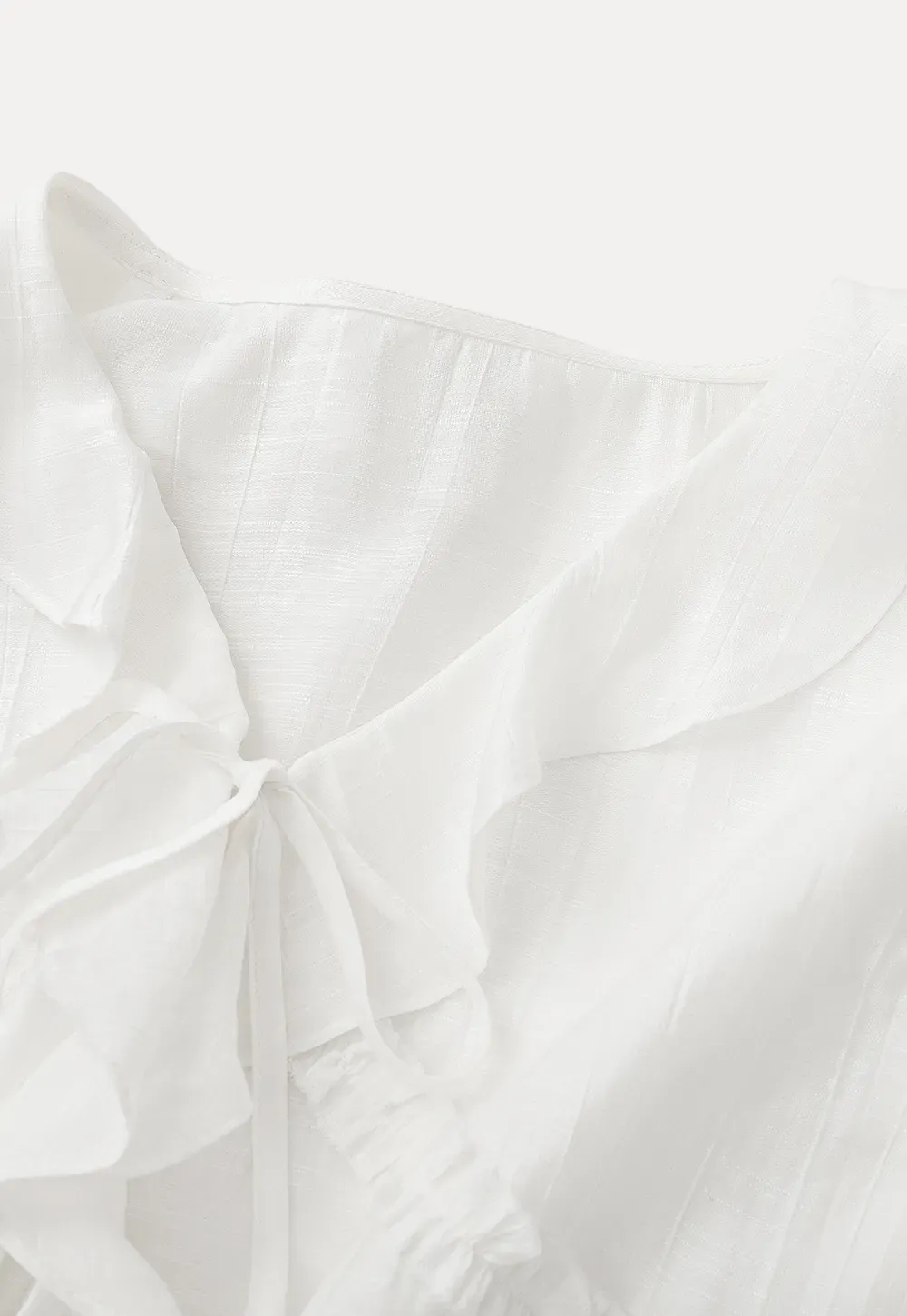 Elegant Blouse with Ruffle Detail and Tie Front Design