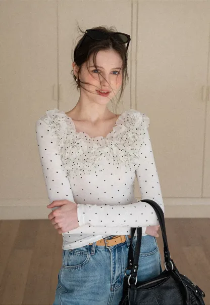 Polka dot long sleeve top with ruffled neckline