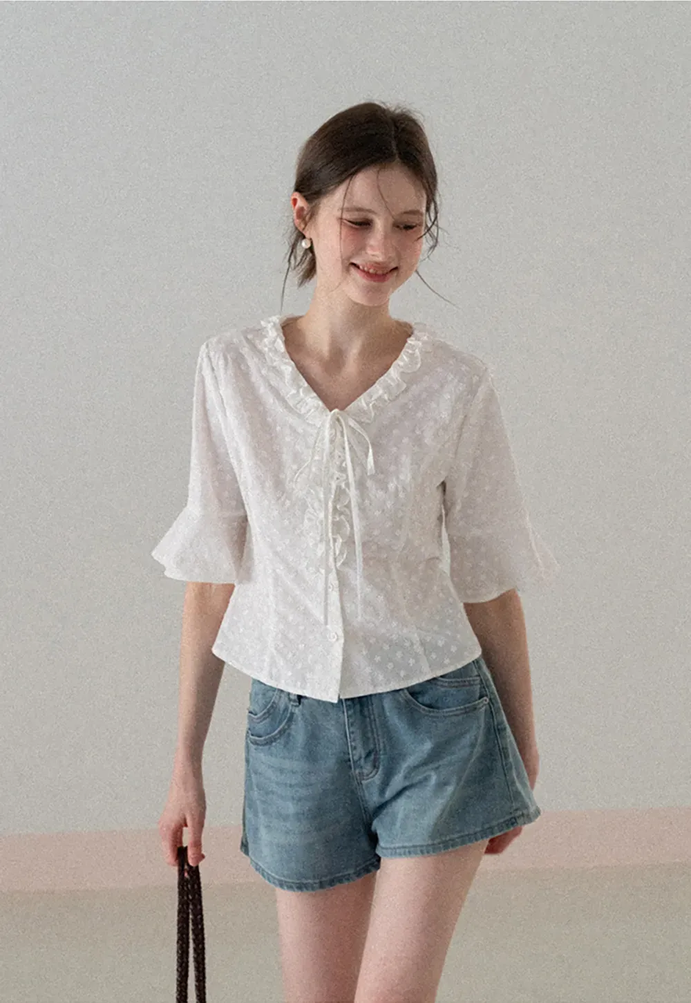 V neck blouse with lace trim and tie front