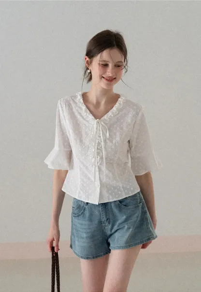 V neck blouse with lace trim and tie front