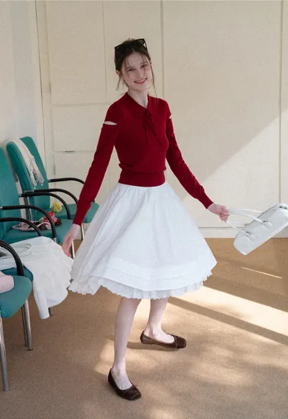 Elegant Knit Sweater with Bow Detail and Cutout Sleeves