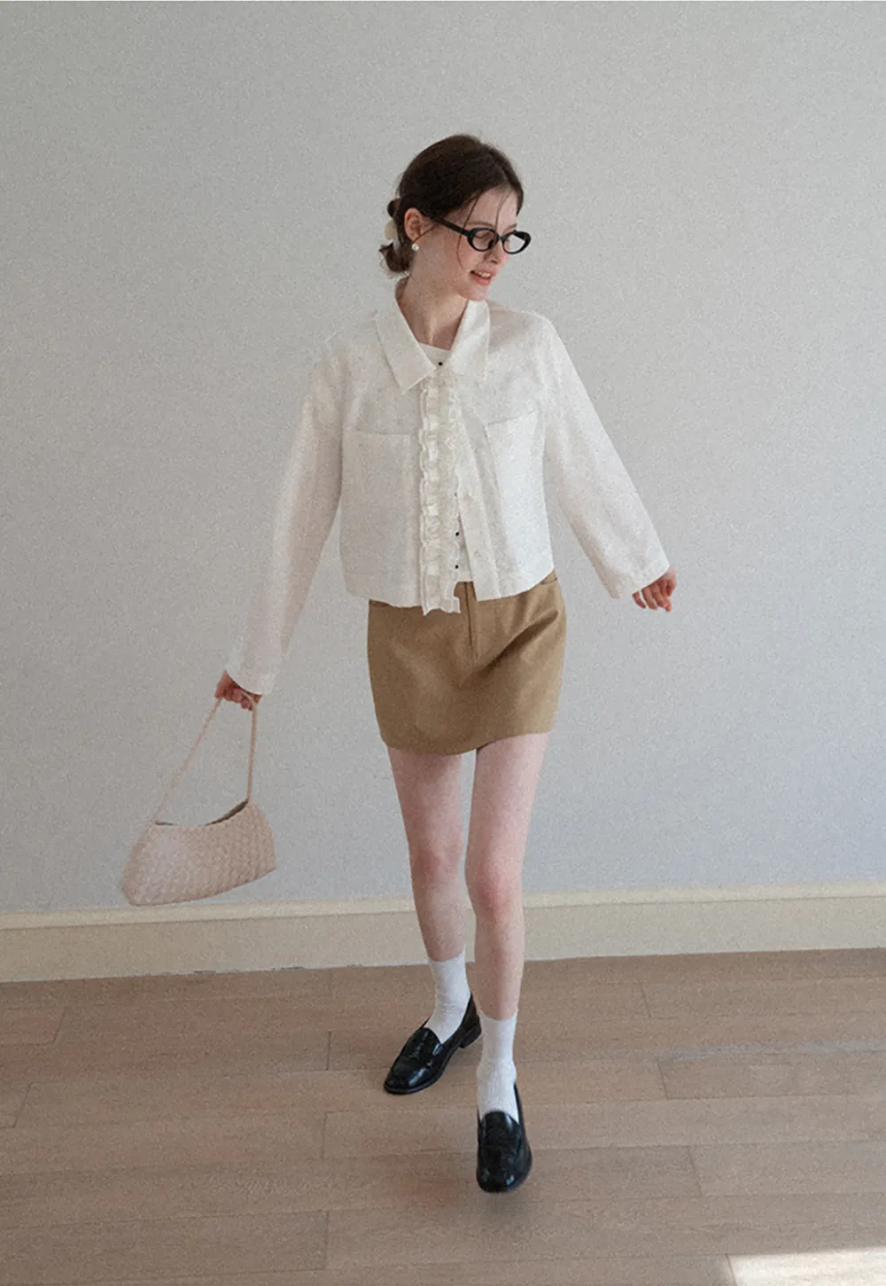 Short jacket with ruffled front placket and collar