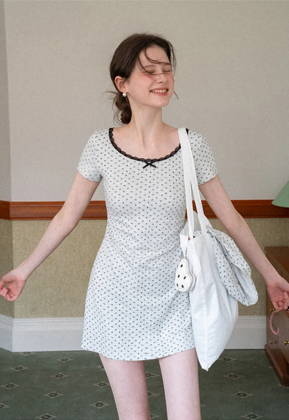 Polka dot dress with lace trim and matching cardigan