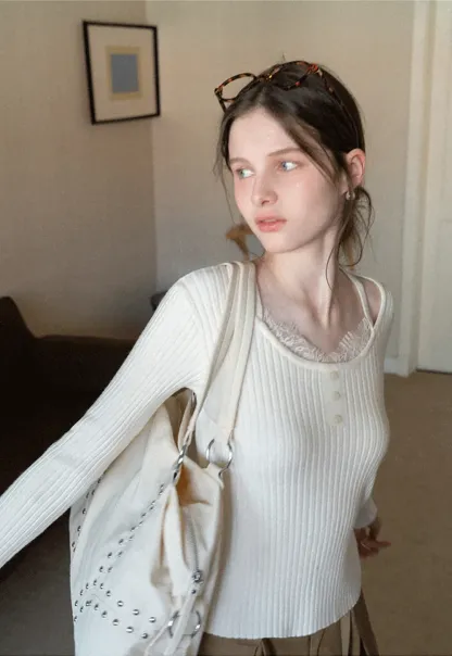 Ribbed knit sweater with boat neck and long sleeves