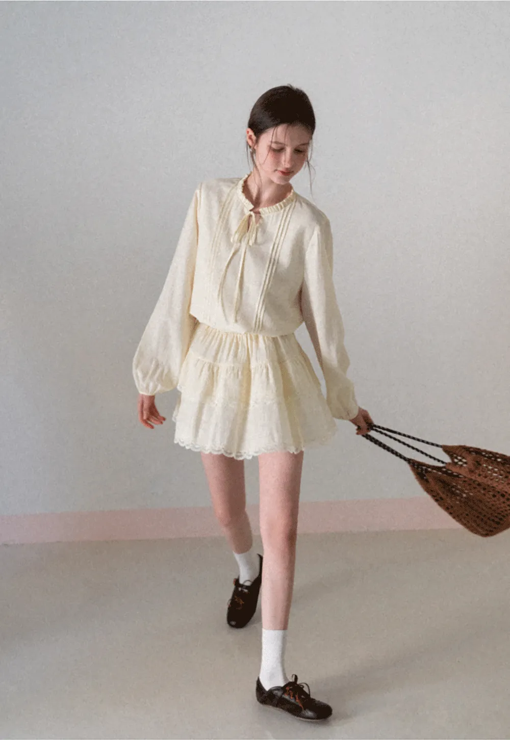 Shirt with ruffled collar and tie front layered skirt