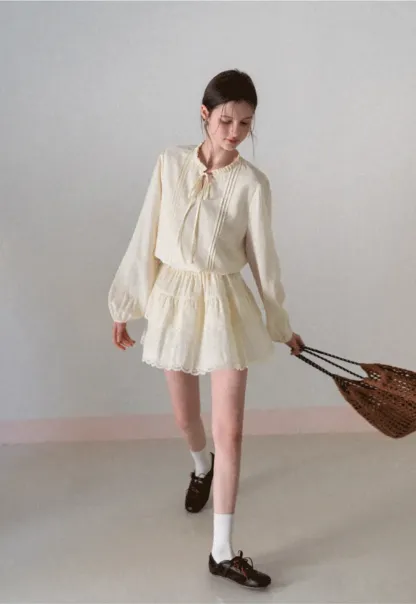 Shirt with ruffled collar and tie front layered skirt