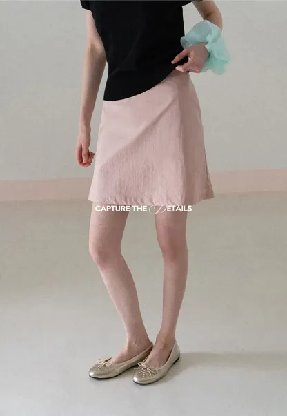 A-line mini skirt with front darts and clean hem
