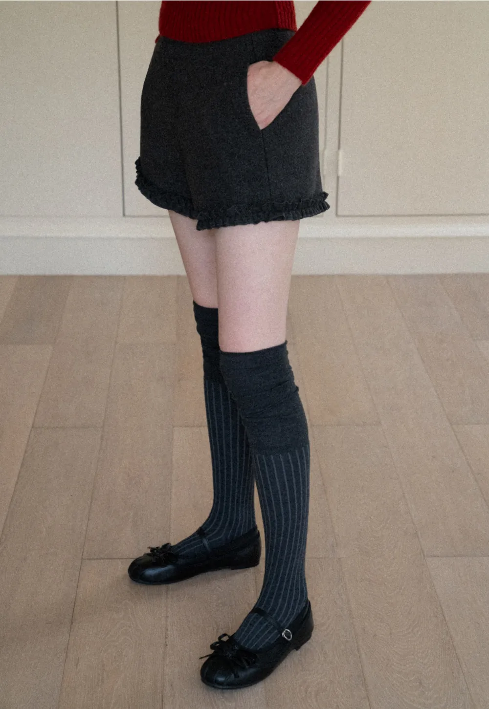 High waist shorts with ruffle hem and belt design