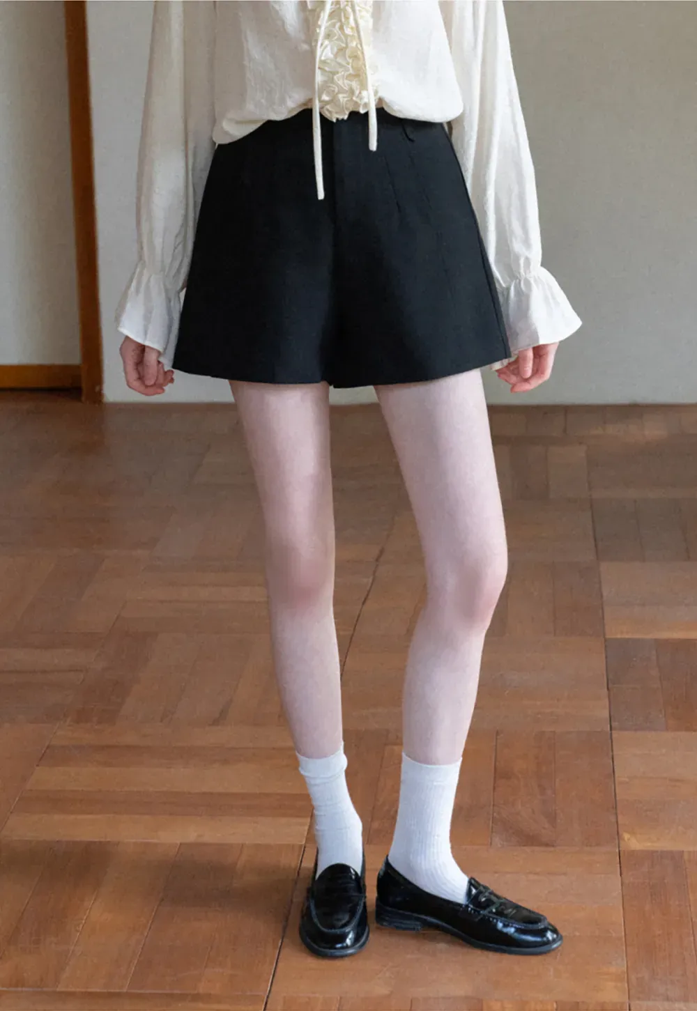 High waist pleated shorts with flared hem