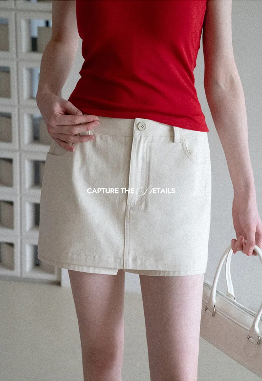 High waist pleated mini skirt with button front design