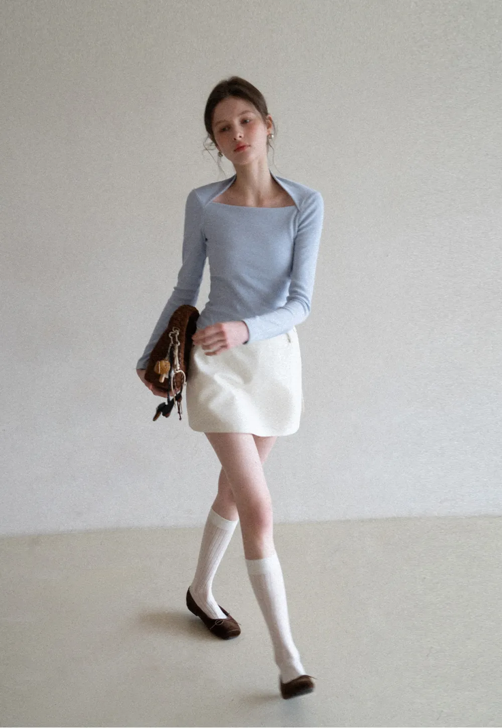 Elegant Pleated Mini Skirt with Asymmetrical Hem