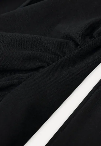 Sleeveless dress with front tie detail and t shirt