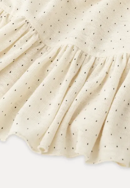 floral dot long sleeve top with ruffle hem