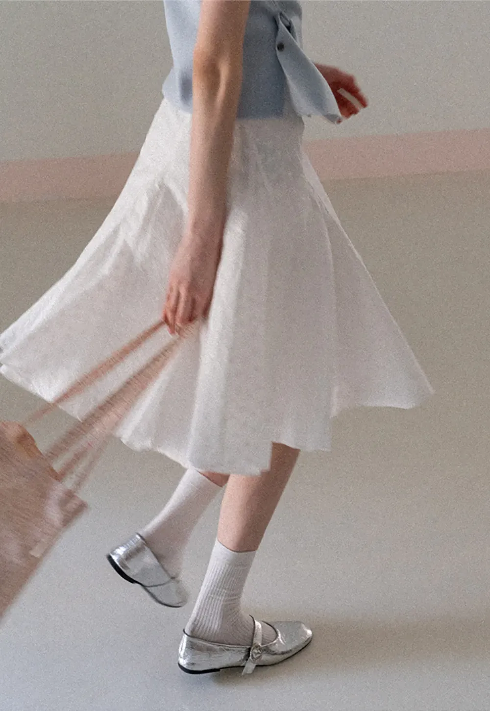 Flared pleated skirt with subtle texture