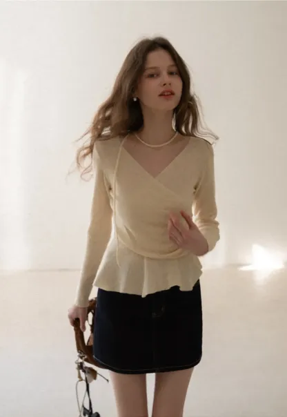 Long sleeve wrap knit sweater with ruched detail