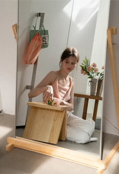 Silk-like tank top with thin straps and draped neckline