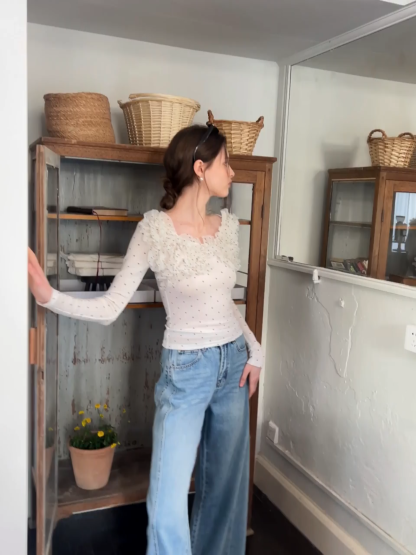 Polka dot long sleeve top with ruffled neckline