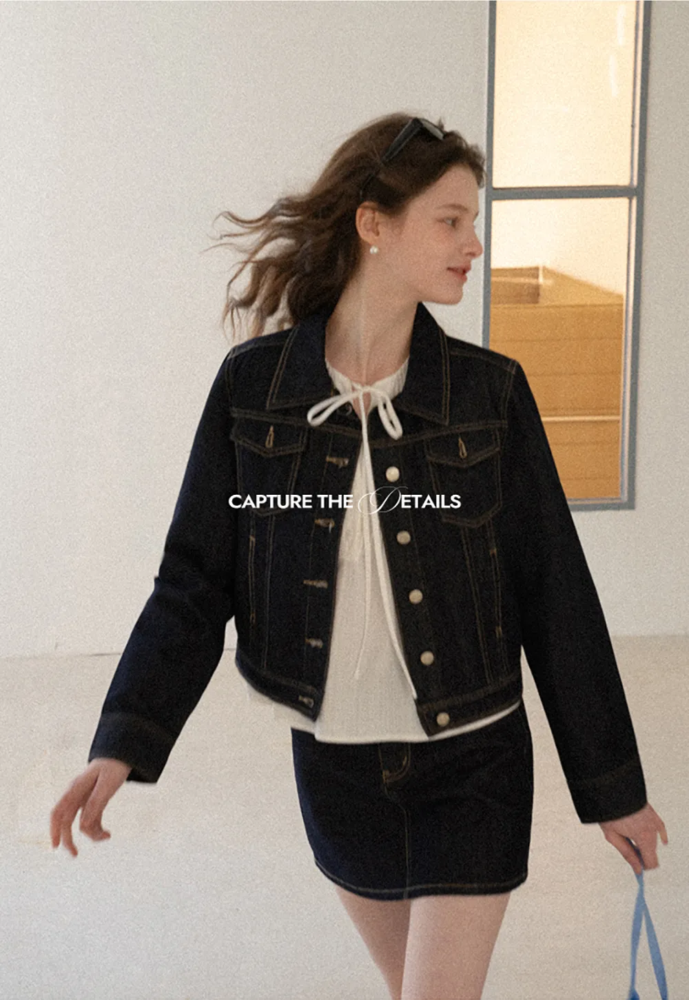 A-line denim skirt with front pocket design and adjustable waistband.