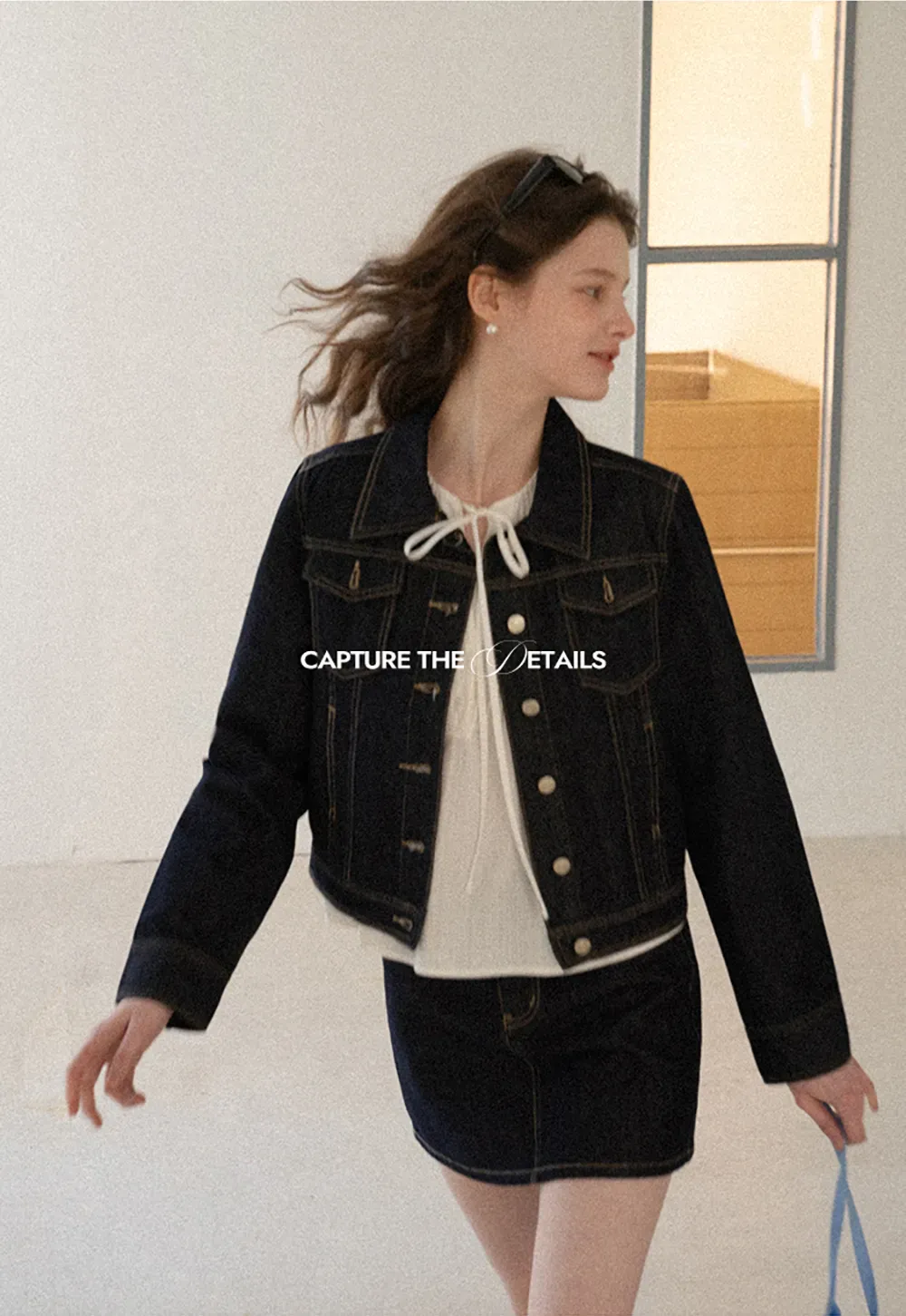 A-line denim skirt with front pocket design and adjustable waistband.