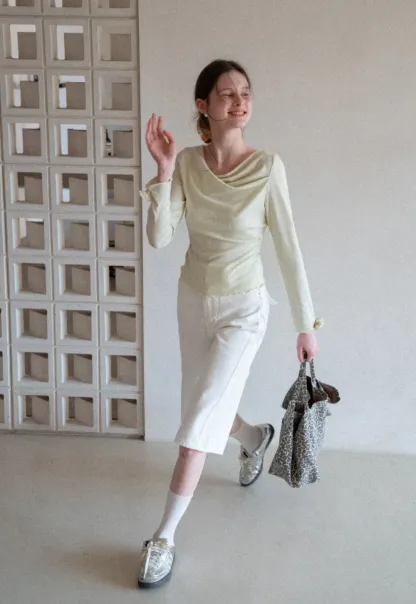 Long sleeve top with ruffled hem and cuffs