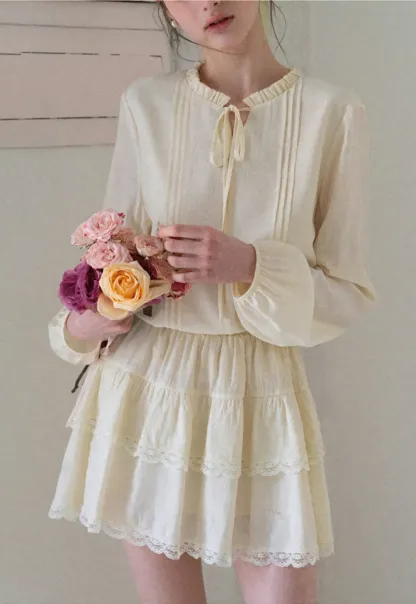 Shirt with ruffled collar and tie front layered skirt