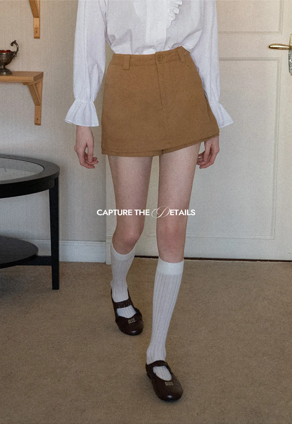 High waist pleated mini skirt with button front design