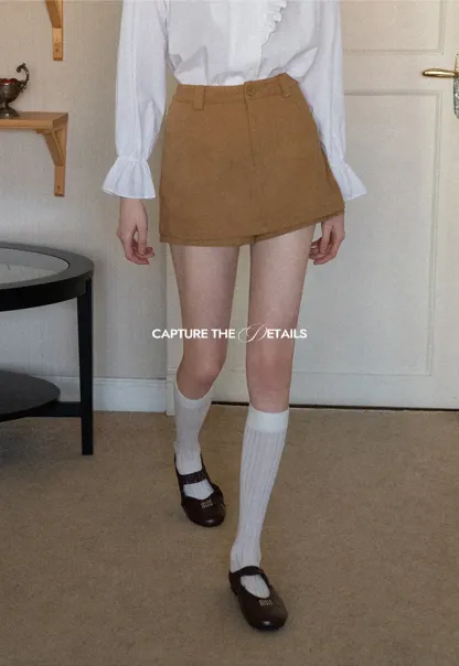 High waist pleated mini skirt with button front design