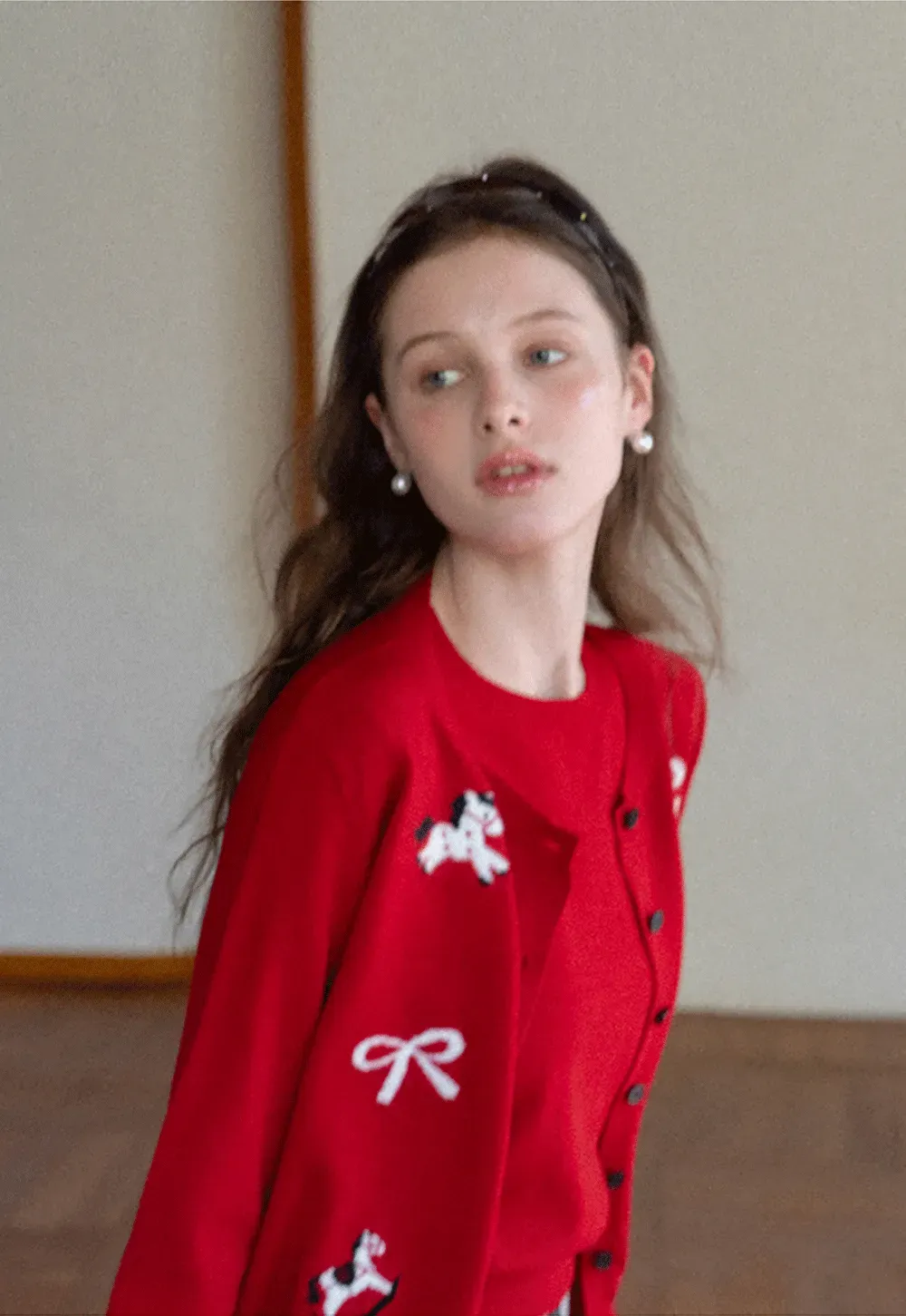 Woolen knit sweater with horse and bow motifs