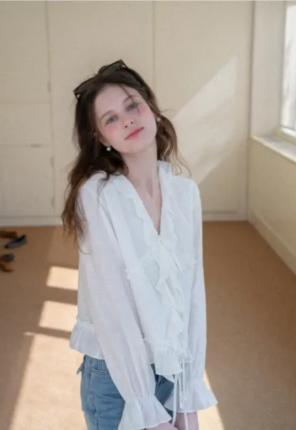 Elegant Blouse with Ruffle Detail and Tie Front Design