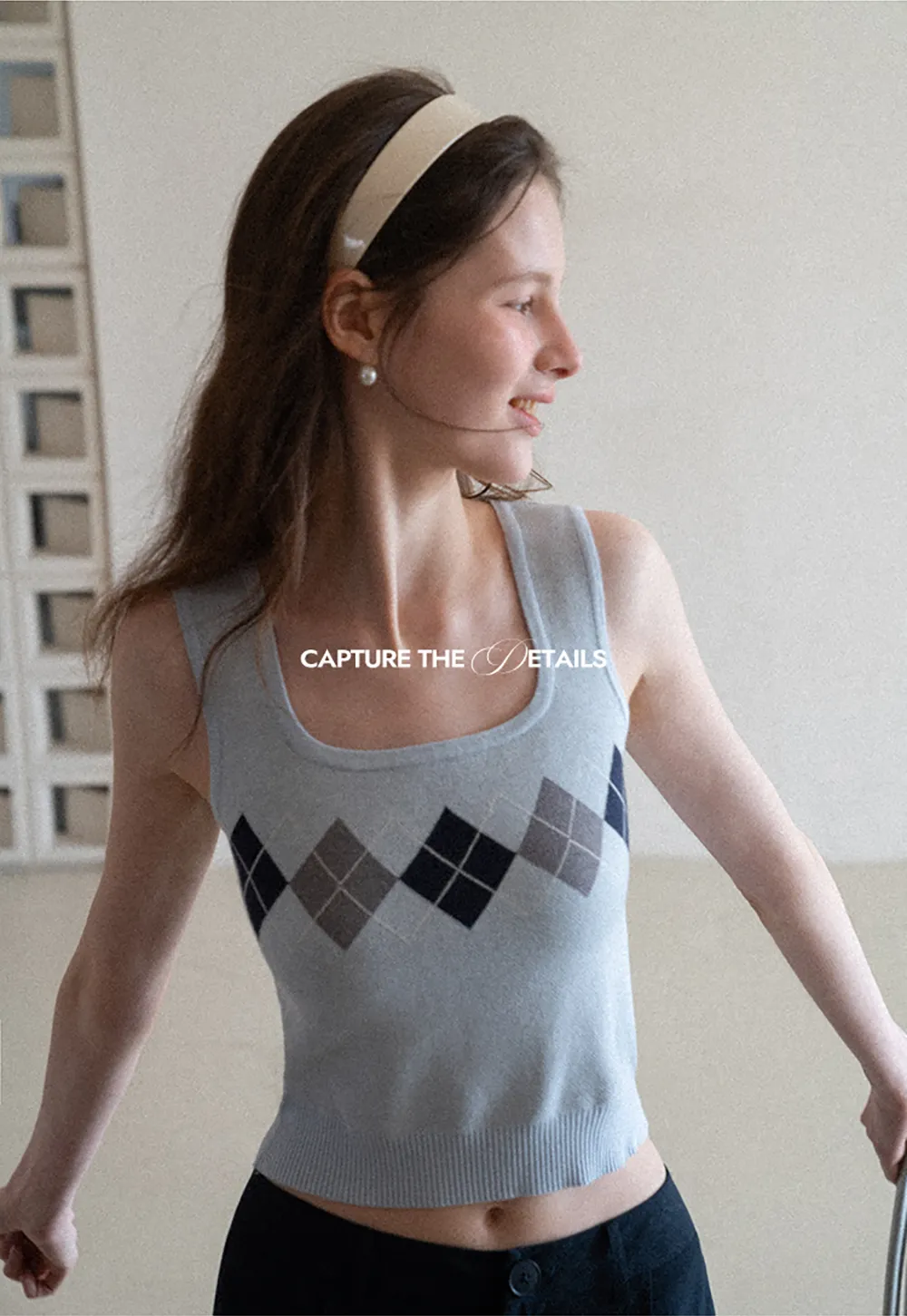 Woolen knit sweater with argyle pattern and buttons