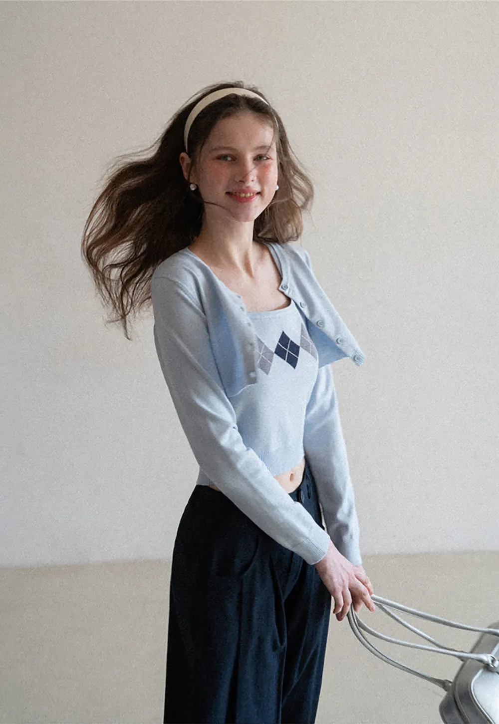 Woolen knit sweater with argyle pattern and buttons