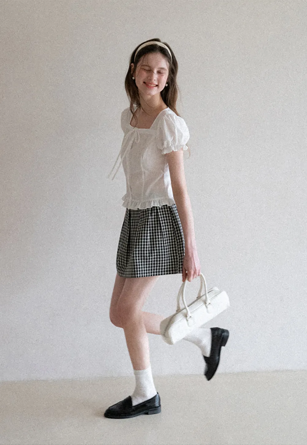 Plaid skirt with pleats and ruffled top