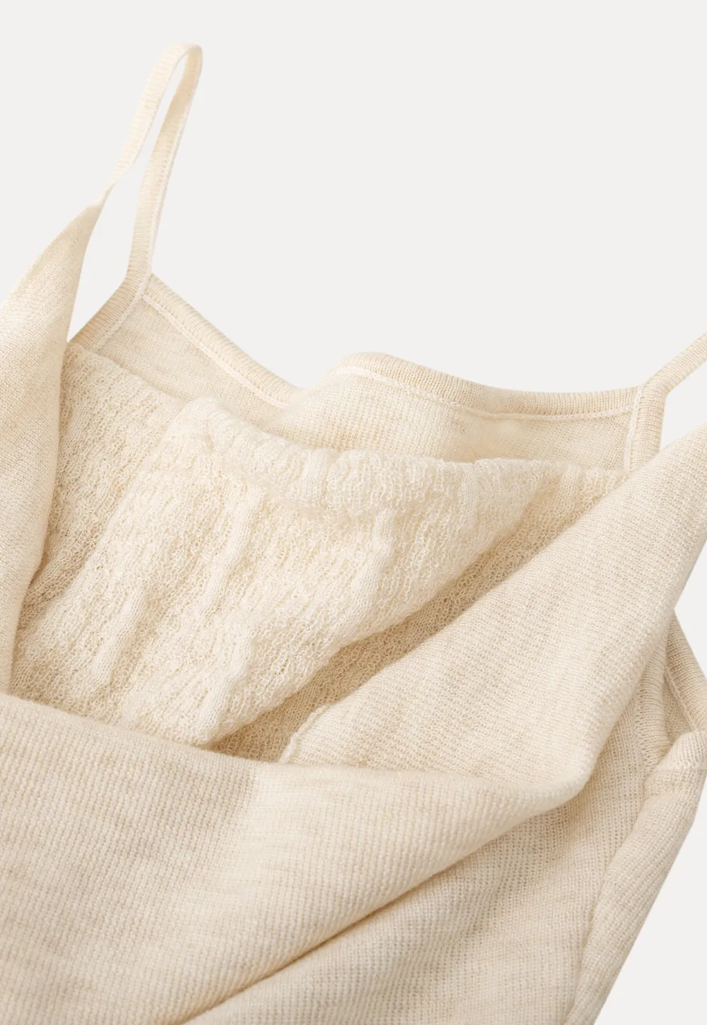 Silk-like tank top with thin straps and draped neckline